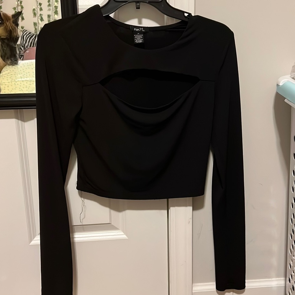 Black long sleeve with a slit in the chest.